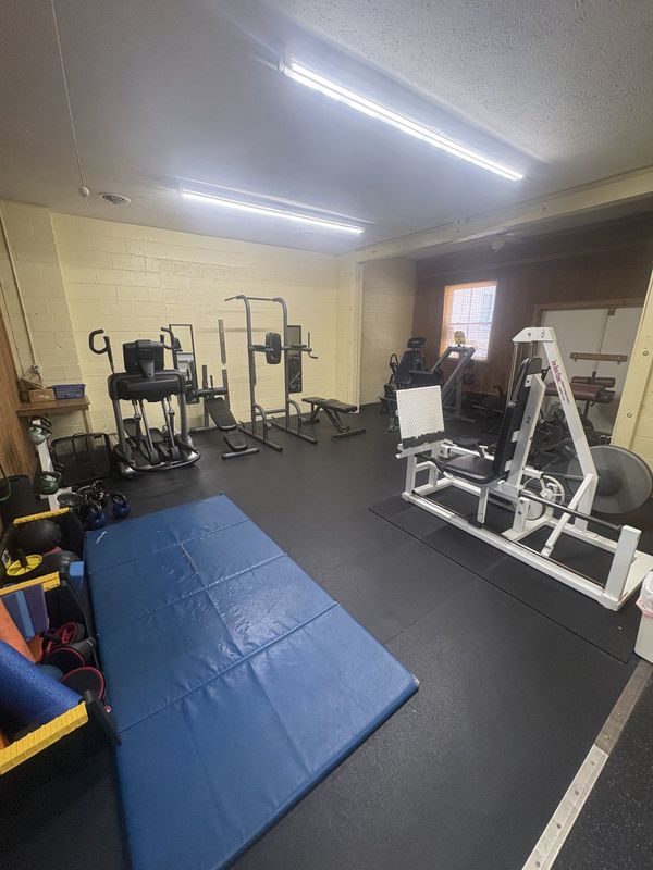 Open stretching and floor-work area with mats